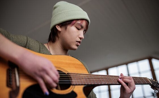Stuent with a guitar